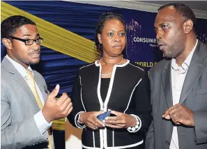  ?? CONTRIBUTE­D ?? Ricardo Dystant (left), head of e-business at JN Bank, in discussion with Dr Moniphia Hewling (centre), head of the Jamaica Cyber Incident Response Team in the Ministry of Science, Energy and Technology, and Assistant Superinten­dent Warren Williams of...