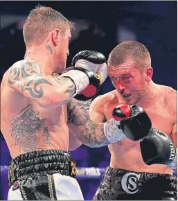  ??  ?? Ricky Burns powers to victory over Scott Cardle