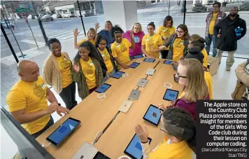  ?? (Joe Ledford/Kansas City Star/TNS) ?? The Apple store on the Country Club Plaza provides some insight for members of the Girls Who Code club during their lesson on computer coding.