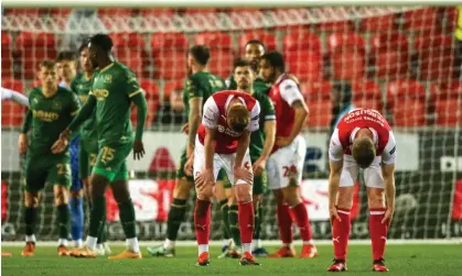  ?? ?? Rotherham players are dejected at the final whistle after defeat by Plymouth. Photograph: Ian Hodgson/PA