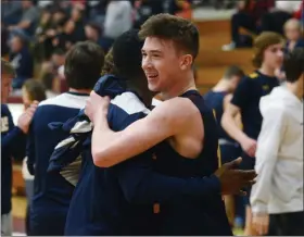  ?? OWEN MCCUE - MEDIANEWS GROUP ?? Pope John Paul II’s Drew McKeon, right, hugs teammate Christian Simpson after Tuesday’s PIAA Class 4A win over Allentown Central Catholic.