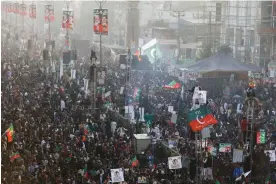  ?? Akhtar Soomro/Reuters ?? Supporters of Pakistan's former prime minister Imran Khan gather in Rawalpindi to see his first public appearance since being wounded in a gun attack earlier this month. Photograph: