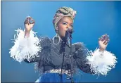  ?? GETTY IMAGES FOR THE ROCK AND ROLL HALL OF FAME ?? Recording artist Lauryn Hill pays tribute to Nina Simone during the Rock &amp; Roll Hall of Fame Induction Ceremony.