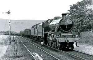  ?? KEN BULL ?? One of the most famous moments in the ‘Jubilee’s’ early main line career was completely unplanned. On August 21 1980, it was uncoupled from its ‘Cumbrian Mountain Express’ at Kirkby Stephen and ran ‘wrong line’ to rescue Class 40 diesel No. 40179, which had failed just north of Garsdale.
Leander hauled the ailing Type 4 and its freight train into Garsdale station, shunted it into the sidings, and then returned to its railtour.