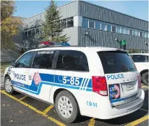  ?? GRAHAM HUGHES/THE CANADIAN PRESS ?? A Montreal police cruiser is shown outside the Lester B. Pearson School Board office on Tuesday. A number of bomb threats have been made against schools across the province.