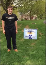  ?? SUBMITTED PHOTO ?? A Kennett High School senior stands near a sign that was provided by volunteers from the Kennett Education Foundation.