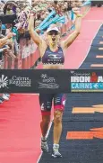  ??  ?? WINNER: Sarah Crowley claims the Cairns Ironman yesterday.