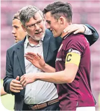  ??  ?? Craig Levein with young defender John Souttar