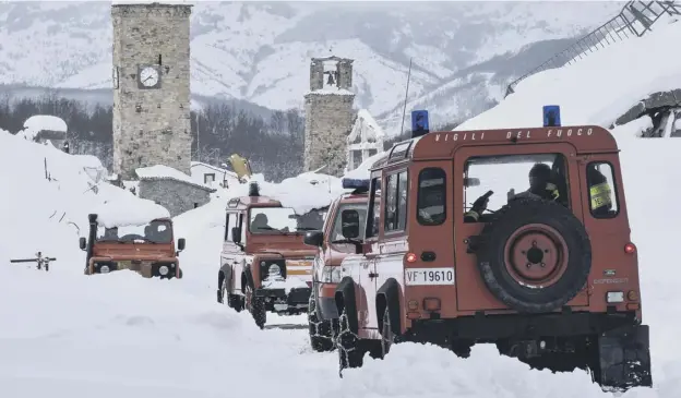  ?? PICTURE: ANDREAS SOLARO ?? 0 Rescue teams struggled to reach the scene of the avalanche as snow left a whole swathe of central Italy blanketed and virtually impassable