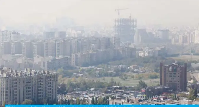  ??  ?? TEHRAN: A general view taken from Western Tehran shows a blanket of brown-white smog covering the city as heavy pollution hit the Iranian capital. — AFP