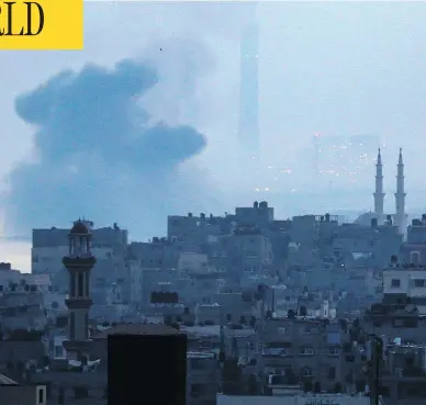  ?? MAHMUD HAMS / AFP / GETTY IMAGES ?? Smoke plumes rise in Gaza City after an Israeli air strike in Beit Lahia on Sunday. Israeli aircraft hit more than a dozen targets in Gaza, the army said, after Palestinia­n projectile fire shattered a ceasefire reached just days prior.