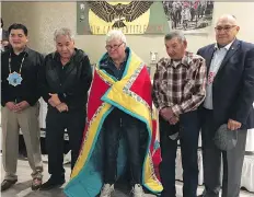  ?? BETTY ANN ADAM ?? Sen. Roland Crowe of the Federation of Sovereign Indigenous Nations, centre, was honoured Thursday at a celebratio­n of the 25th anniversar­y of signing the Treaty Land Entitlemen­t framework agreement. From left, Chief Bobby Cameron, elder William Ratfoot, elder Barney Tipewan and vice chief Dutch Lerat, presented the star blanket.