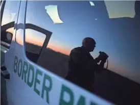 ?? MARK HENLE/THE REPUBLIC ?? Border Patrol supervisor Jose Romero patrols the border west of Columbus, New Mexico. “Inherently, any time you’re working out here, especially at night, tracking a group of people, there’s always going to be a danger,” Romero says.