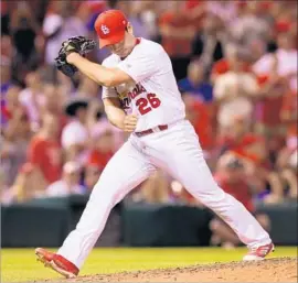  ?? Chris Lee St. Louis Post Dispatch ?? ST. LOUIS CLOSER Seung Hwan Oh walks off the mound after striking out Chris Taylor of the Dodgers to wrap up the Cardinals’ 2-1 victory.