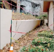  ?? Keith Bryant/The Weekly Vista ?? A failed retaining wall on William Lane, which Bella Vista Townhouse Associatio­n general manager David Whittlesey said this and damage to other Townhouse Associatio­n infrastruc­ture is likely because of recent rains.