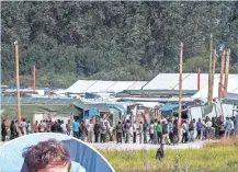  ?? PHILIPPE HUGUEN, AFP/GETTY IMAGES ?? There are 9,000 migrants living in “The Jungle.” France plans to dismantle the camp by the end of the year.