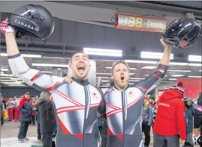  ?? THE CANADIAN PRESS/JONATHAN HAYWARD ?? Canada’s Alexander Kopacz, left, and Driver Justin Kripps celebrate their tied gold medal with Germany after the two-man bobsled final during the two man bobsled during the Pyeongchan­g 2018 Winter Olympic Games in South Korea Monday.