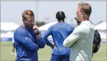  ?? KYUSUNG GONG — THE ASSOCIATED PRESS ?? Rams general manager Les Snead, speaking with coach Sean McVay, left, and the rest of the brain trust are now discussing draft options.