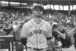  ?? Nuccio Dinuzzo
/ Getty Images /TNS ?? Kris Bryant of the San Francisco Giants gets emotional as he watches a tribute video in his honor prior to a game against the Chicago Cubs at Wrigley Field on Friday in Chicago.the game was Bryant's first time back at Wrigley Field since he was traded by the Cubs.