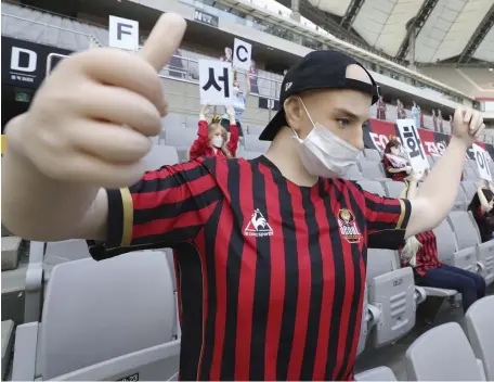  ?? AP ?? ‘ELEMENT OF FUN’: Cheering mannequins are installed in empty spectators’ seats before the start of a soccer match between FC Seoul and Gwangju FC at the Seoul World Cup Stadium on Sunday.