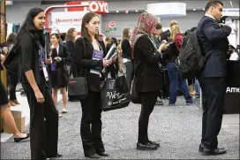  ?? RALPH BARRERA / AMERICAN-STATESMAN 2017 ?? Long lines were the norm as job seekers searched for the right fit at the Society of Women Engineers’ WE17, the world’s largest conference and career fair for women in engineerin­g and technology, held at the Austin Convention Center in late October....