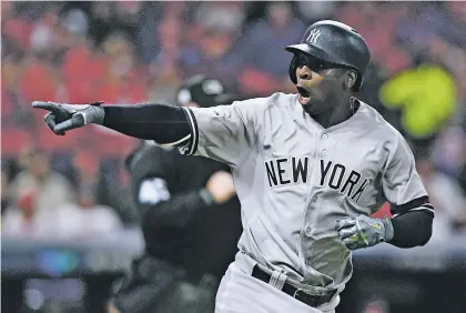  ??  ?? New York Yankees’ Didi Gregorius celebrates after hitting a two-run home run off Cleveland Indians starting pitcher Corey Kluber during Game 5 of an American League Division Series on Wednesday in Cleveland. Gregorius homered twice off Kluber.