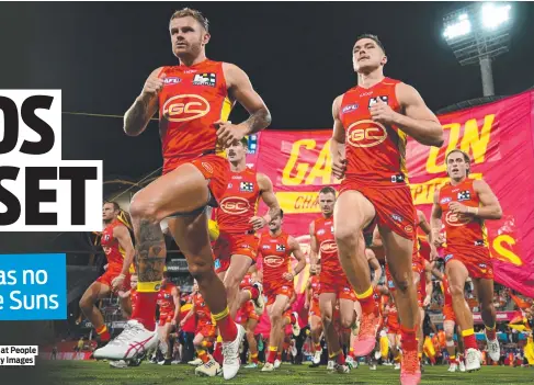  ?? ?? Suns players take to the field for the clash with the Crows at People First Stadium. Picture: Matt Roberts/AFL Photos/via Getty Images