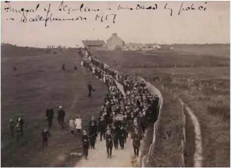  ?? Photo by Domnick Walsh ?? Pipers lead the funeral procession of Ballybunio­n’s Daniel Scanlon down by the Golf Course on the Sandhill Road in 1917, an image discovered by Tralee man John Lawlor in a family album recently – possibly taken by his Listowel native great-grandfathe­r. RIGHT: Our recent coverage of the discovery showing John Lawlor displaying the album in his Tralee home.