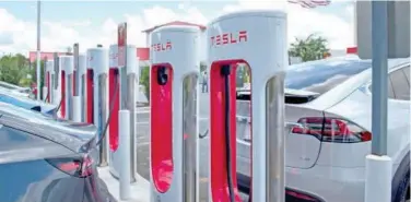  ?? File/associated Press ?? ↑
A Tesla charging station in Florida.