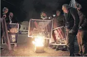  ?? [AP PHOTO] ?? Palestinia­ns burn a poster of the U.S. President Donald Trump during a protest Tuesday in Bethlehem, West Bank.