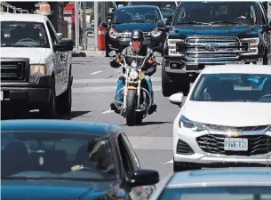  ?? JOHN RENNISON THE HAMILTON SPECTATOR ?? A motorcycli­st travels on the road in Hamilton. Riders are reminded to be aware as the spring riding season gets underway.