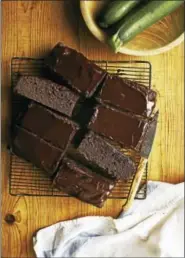  ?? JOHNNY AUTRY / EXCERPTED FROM “THE HARVEST BAKER,” USED WITH PERMISSION FROM STOREY PUBLISHING ?? Chocolate sour cream zucchini cake with chocolate glaze.