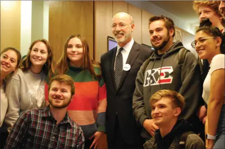 ?? LISA MITCHELL — MEDIANEWS GROUP ?? Gov. Tom Wolf with Kutztown University students during his visit to campus on March 4. On a tour of the 14PASSHE schools, Wolf is promoting his proposed Nellie Bly Scholarshi­p that addresses the student loan debt in Pennsylvan­ia.