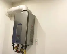  ??  ?? Gas-fired tankless water heaters like this one can heat water regardless of how cold the supply is. Proper sizing of the unit is key.
