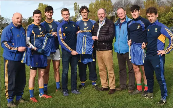  ??  ?? Michael O’Sullivan of O’Sullivan’s Beaufort Bridge (sixth from left) Presenting a set of togs to the Beaufort Captain Nathan Breen for their match against Ballylooby, Castlegrac­e Tipperary in the Munster Junior Championsh­ip (from left) Fergus Kelly, Kevin Ferris, Maurice Breen, Frank Coffey Club Chairman, Mike Breen and Eanna O’Malley at Beaufort GAA Grounds on Sunday. Photo by Michelle Cooper Galvin