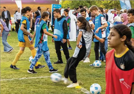  ?? RON PRZYSUCHA/U.S. DOS/TNS 2022 ?? Young soccer players kick balls during a sports diplomacy event Nov. 21 hosted by U.S. Secretary of State Antony J. Blinken in Doha, Qatar. The U.s.-sponsored program is meant to engage embassies and consulates overseas in an effort to highlight foreign-policy goals.