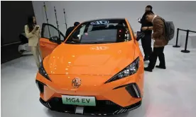 ?? Pardo/AFP/Getty Images ?? The MG 4 EV electric sports car on display at the Beijing Auto Show. Photograph: Pedro