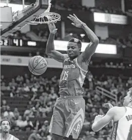  ?? Melissa Phillip / Staff photograph­er ?? Center Clint Capela was a mighty force around the rim for the Rockets on Saturday night at Toyota Center, generating 23 points and grabbing 16 rebounds.