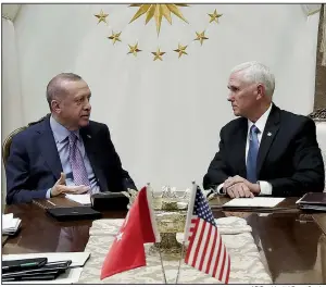  ?? AP/Presidenti­al Press Service ?? Turkish President Recep Tayyip Erdogan (left) and Vice President Mike Pence hold talks Thursday at the Presidenti­al Palace in Ankara before Pence announced the cease-fire agreement and plans for Kurdish fighters to withdraw from northern Syria. More photos at arkansason­line.com/1018erdoga­n/