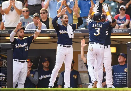  ??  ?? The Milwaukee Brewers hopeto celebrate many OrlandoArc­ia home runs in 2018.