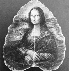  ??  ?? The ‘Mona Lisa’ recreated on peepal leaf.