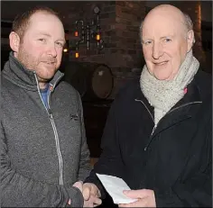  ??  ?? James Robinson, Ridleys Nite Club makes a preseentat­ion to Kevin Mulligan, St Vincent de Paul..