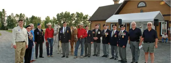  ??  ?? Paul and Terry Nichols with members of the Hawkesbury Royal Canadian Legion Branch 472 along with MP Pierre Lemieux, Champlain Mayor Gary Barton, and Champlain council member Jacques Lacelle, took a moment for a photo with their horses. Newly appointed...