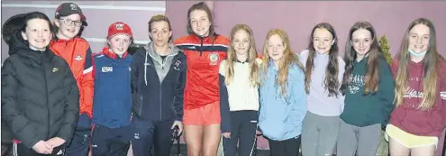  ?? ?? Thea Coleman, of the victorious Cork All-Ireland Minor camogie squad, welcomed back to Mitchelsto­wn by members of St Fanahan’s Camogie Club, after Saturday’s victory.