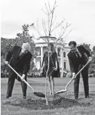  ?? AFP/GETTY IMAGES ?? First lady Melania Trump watches Presidents Trump and Macron plant a tree Monday.