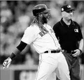  ?? ELSA/GETTY ?? Hanley Ramirez lets out a yell after hitting a two-run double Sunday for the Red Sox in their win over the Astros.