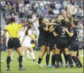  ?? ANGEL CITY FC ?? Angel City Football Club players celebrate teammate Savannah McCaskill’s goal at the beginning of Friday’s game against the Portland Thorns in Los Angeles. The two teams tied, 1-1.