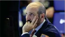  ?? RICHARD DREW — THE ASSOCIATED PRESS ?? Specialist James Denaro works on the floor of the New York Stock Exchange, Monday.