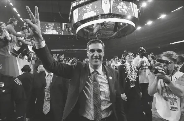  ?? DAVID J. PHILLIP/AP ?? VILLANOVA COACH JAY WRIGHT celebrates after the NCAA men’s college basketball tournament championsh­ip game against North Carolina, April 4, 2016, in Houston. Villanova won 77-74. Wright, who led the Wildcats to two national championsh­ips and four Final Fours, stunned college basketball with his resignatio­n on Wednesday night.