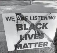  ?? Kara Harris via AP ?? A crossed out Black Lives Matter yard sign can be seen in front of Jeff and Kara Harris’ home in Mableton.